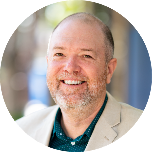 David Rhoads smiles for a headshot photo