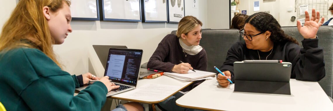 A group of students interact with each other