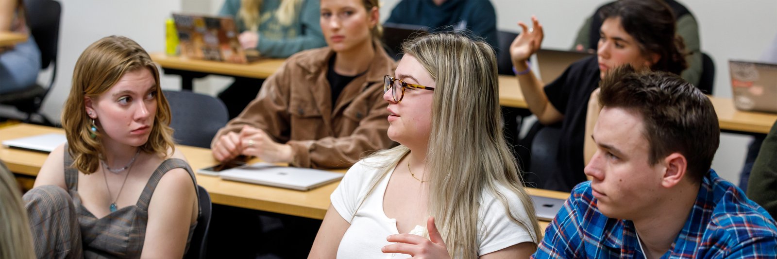 A group of students interact with each other