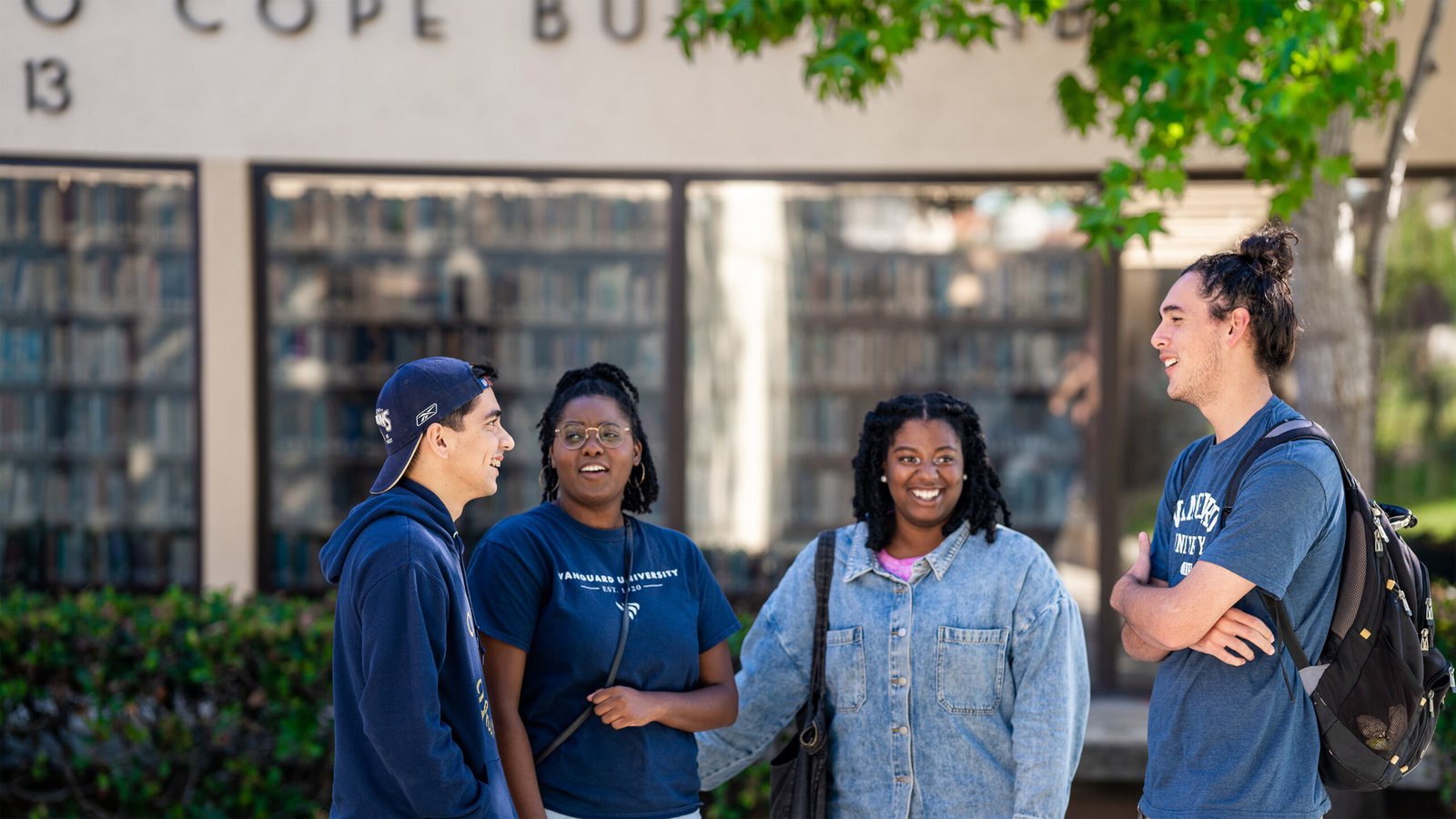 Students gather outside the library