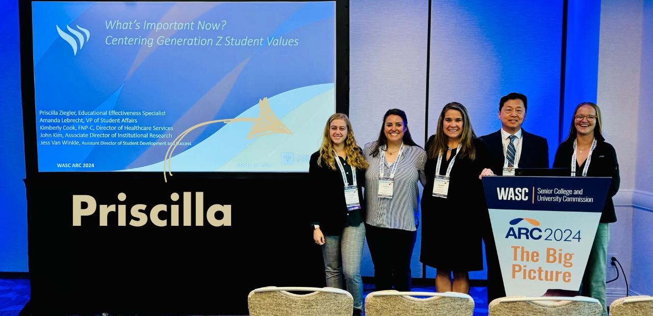 Group of presenters stand in front of a podium